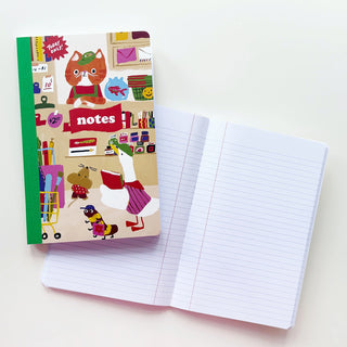 Notebook with illustration of animals shopping at a stationery store, next to an opened notebook with lined pages