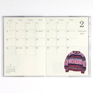 Monthly planner page for February 2027 with date grid and patterned sweater