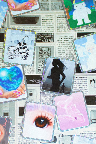 Collage of vinyl stickers with eye, blue heart hand, silhouette, and light holographic frames