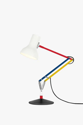 Mini desk lamp with white shade and red-blue striped arm, black base and power cord.