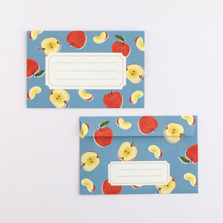 Two envelopes with apple pattern on a blue background