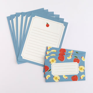 Letter set with envelopes with apple design on a light blue background