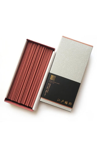 Modern incense sticks in open box with patterned outer sleeve