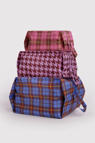3D zip pouch set with burgundy, magenta houndstooth and blue plaid pouches