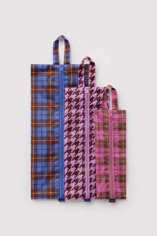 3D zip pouch set with blue plaid, maroon houndstooth, and pink check pouches