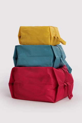 BAGGU 3D zip set of three pouches in yellow, teal, and red with zippers