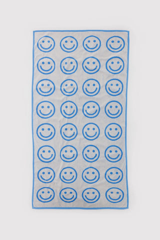 Sky blue smiley bath towel with outlined happy face pattern