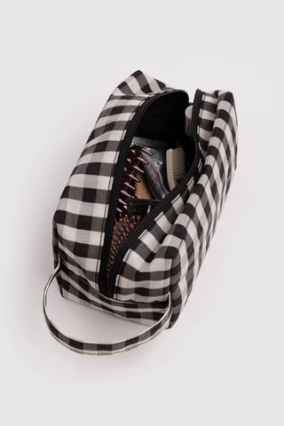 Gingham toiletry bag open showing black zip lining and interior pockets