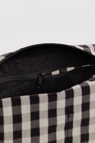 Gingham dopp kit interior with black zipper, zipper pull, and lining