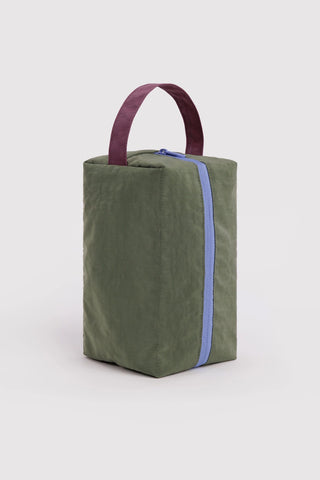 BAGGU dopp kit in olive green with maroon handles and blue-trim zipper pocket
