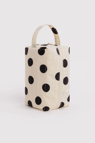 Cream canvas dopp kit with black polka dots and top handle