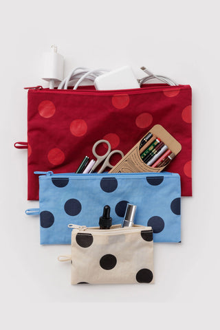 Polka dot flat pouch set with zippers in red, blue, and beige; contents shown