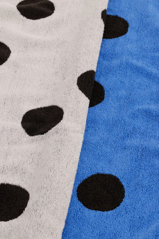 Hand towel with polka dot pattern, black dots on blue and white terry fabric