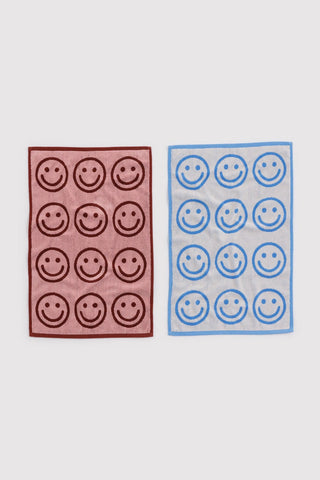 Set of 2 hand towels, sky blue and blush with smiling face pattern