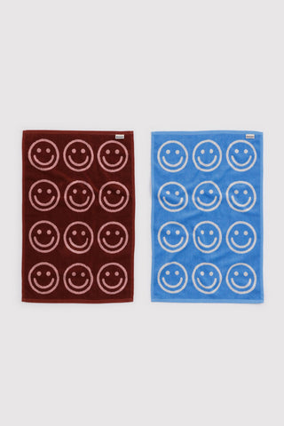 Set of 2 hand towels in sky blue and blush, smiling face grid design