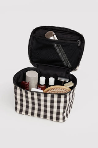 Large cosmetic case open, black interior with gingham exterior and zipper closure