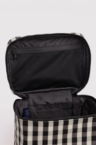 Large cosmetic case interior with black lining and zippered pocket, gingham outer edge