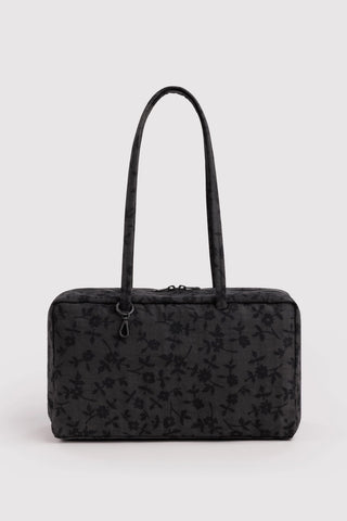 Medium nylon bowler bag, charcoal with small floral print, top handles and zipper.