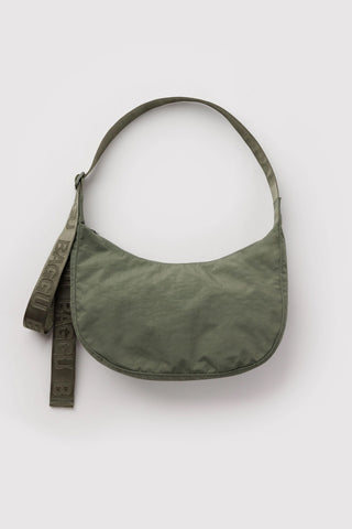 Olive nylon crescent shoulder bag with curved flap and printed web strap