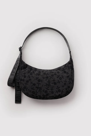 Medium crescent nylon bag in charcoal with small floral pattern and adjustable strap