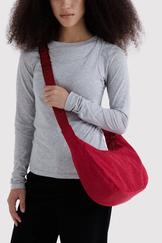 Medium crescent nylon bag worn crossbody, cherry red with long strap