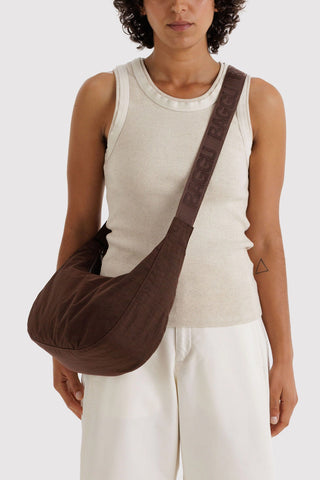 BAGGU medium crescent nylon bag, coffee brown crossbody strap worn over shoulder