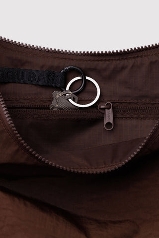 BAGGU medium crescent bag close-up: zipper, interior pocket, D-ring and key clip