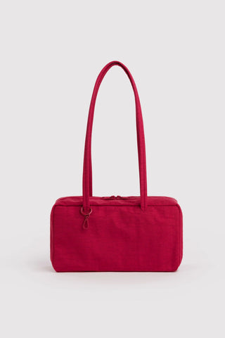 Red nylon bowler bag with top handles and zippered front pocket