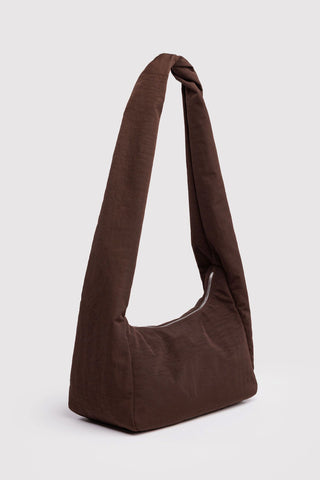 Brown shoulder bag on a light gray background