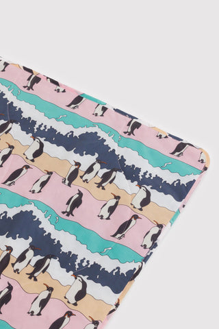 Picnic planket with penguin pattern on a white background