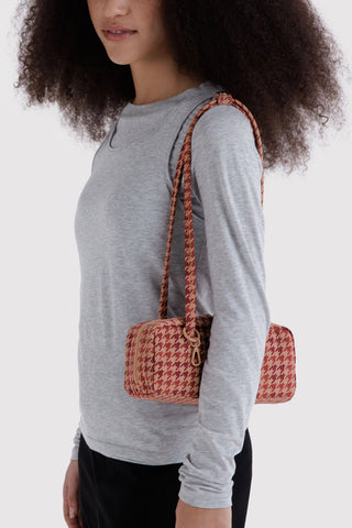 Small houndstooth nylon bowler bag, tan and maroon, carried by two handles