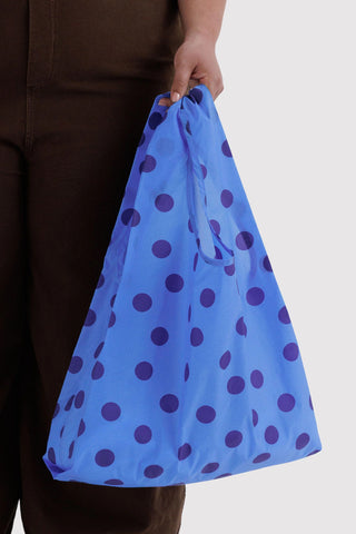 Blue polka dot tote bag with drawstring-style gathered top