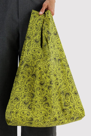 Chartreuse paisley tote bag held by short handles, open top