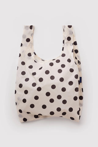 Cream tote bag with black polka dots, open top and long handles