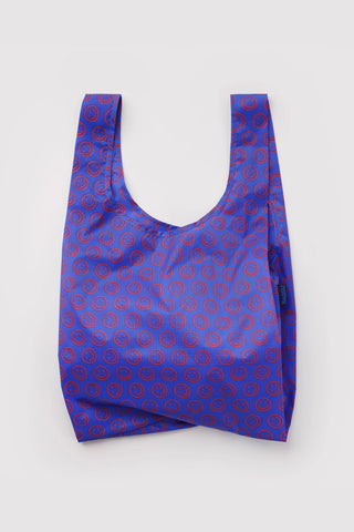 BAGGU mini tote bag in cobalt blue with red smiley circle pattern