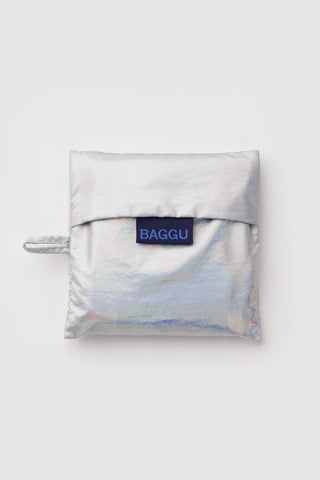 Folded silver reusable bag with 'BAGGU' logo on a white background