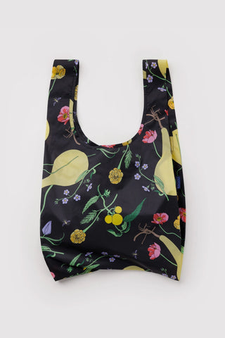Packable tote bag with black ground and yellow-green botanical print
