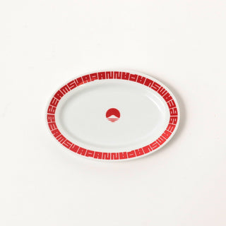 White plate with red decorative border and logo on a white background