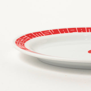 White plate with red rim and 'Beams' branding on a white background