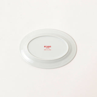 White ceramic plate with 'BEAMS' branding on a white background