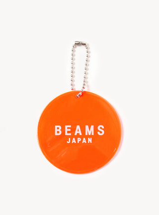Back of orange keychain with beams japan logo