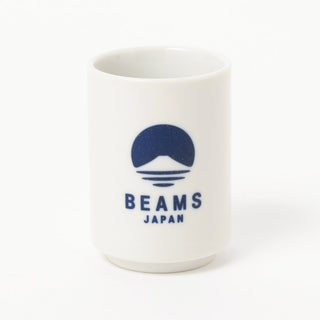 White mug with blue 'BEAMS JAPAN' logo on a white background
