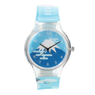 Wristwatch with blue strap and mountain design on face against a white background