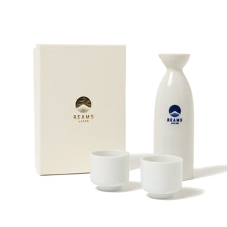 White ceramic sake set with two cups and a bottle, featuring the 'Beams Japan' logo, on a white background.