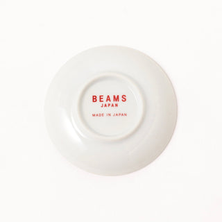 White dish with 'BEAMS JAPAN', 'Made in Japan' text on the back on a white background