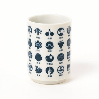 White mug with navy geometric symbols on a white background