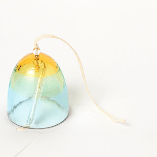 Glass wind chime with gradient colors on a white background