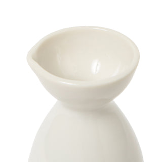 Close up of white ceramic bottle on a white background