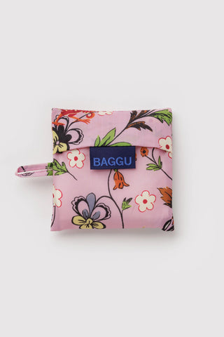 Pink BAGGU pouch with floral and creature print, blue logo patch