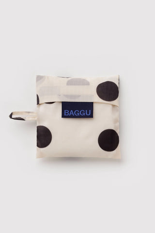 Baby BAGGU polka dot bag, cream with black dots, folded with BAGGU label